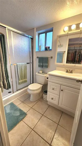 a hallway with stairs and wooden floor