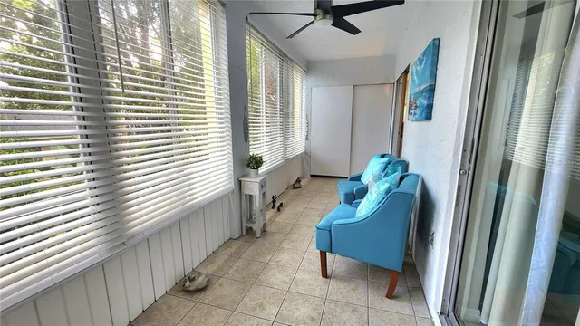 a view of a hallway with wooden floor and entryway