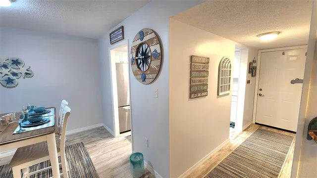 a view of a dining room with furniture and a window