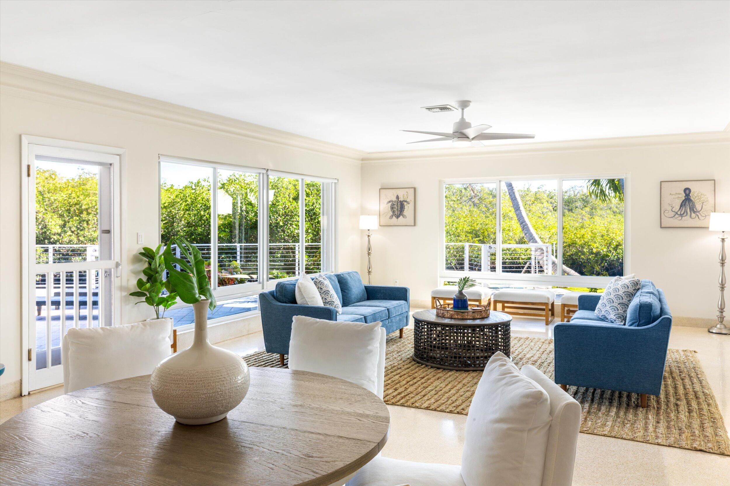 3446 Riviera Drive Key West, FL 33040 - Photo 18 of 73 a living room with furniture and a large window