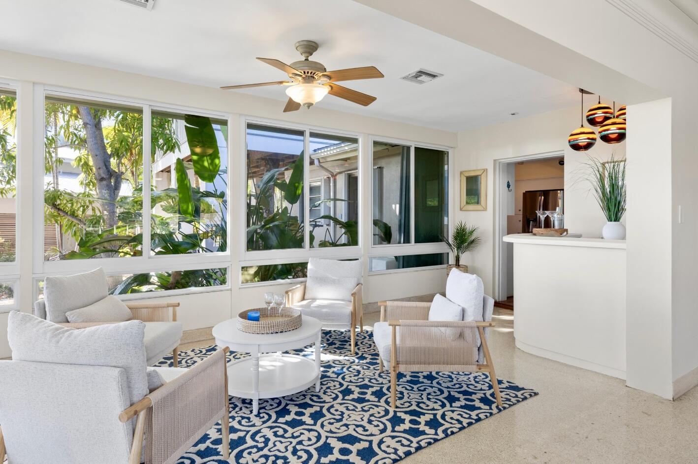 3446 Riviera Drive Key West, FL 33040 - Photo 26 of 73 a living room with furniture and a large window