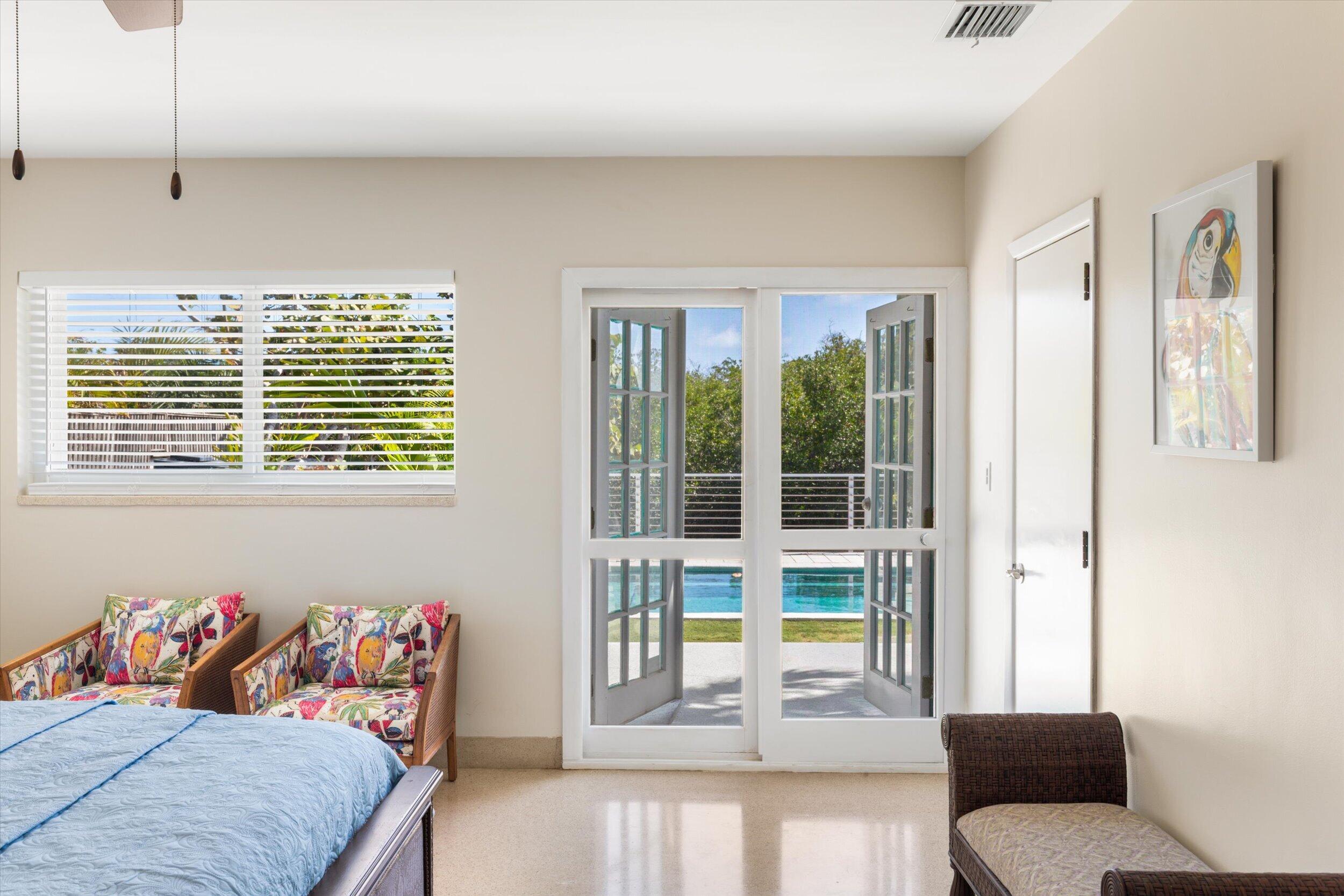 3446 Riviera Drive Key West, FL 33040 - Photo 40 of 73 a living room with a couch and a large window