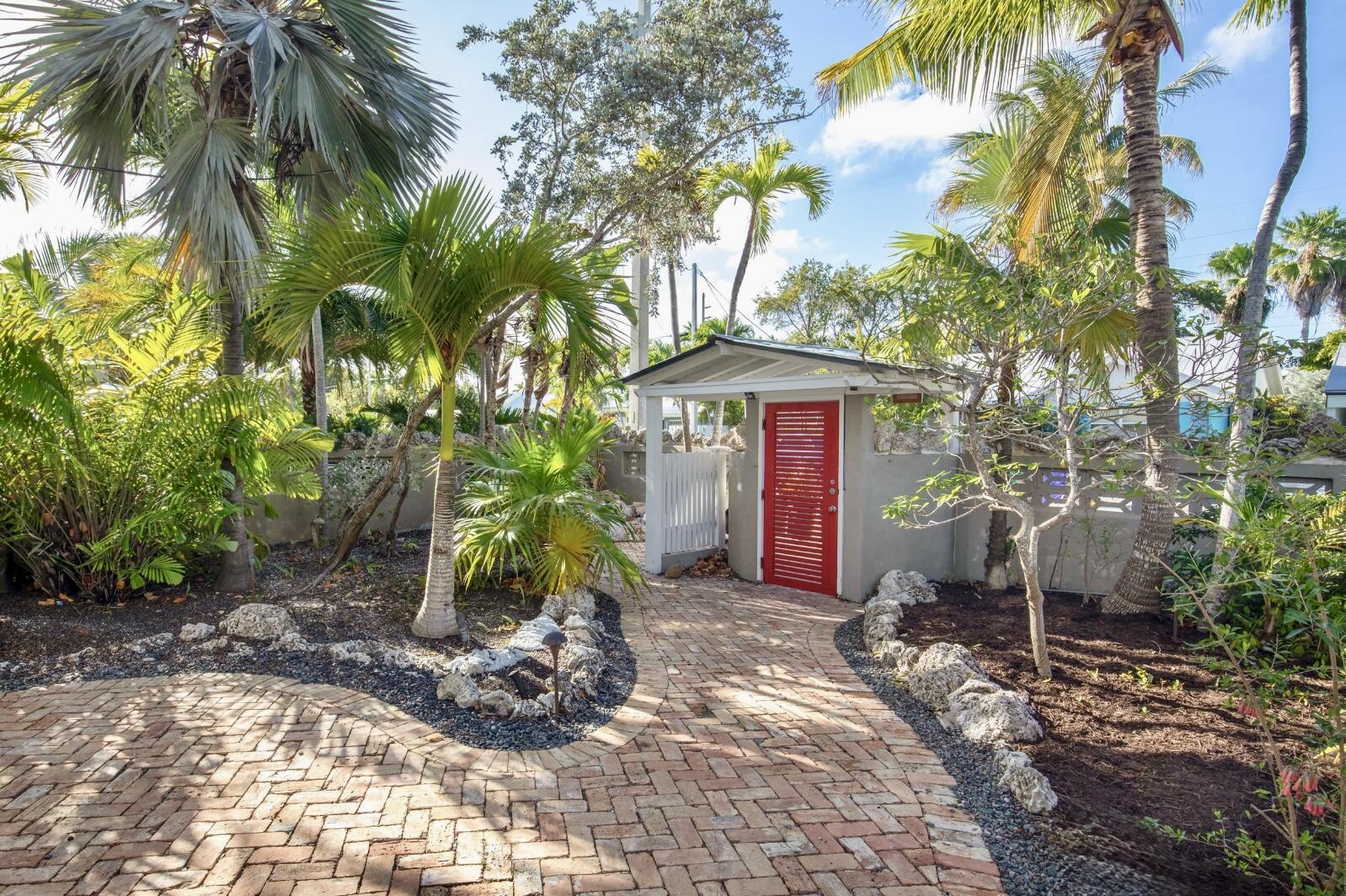 3446 Riviera Drive Key West, FL 33040 - Photo 67 of 73 a front view of a house with a yard