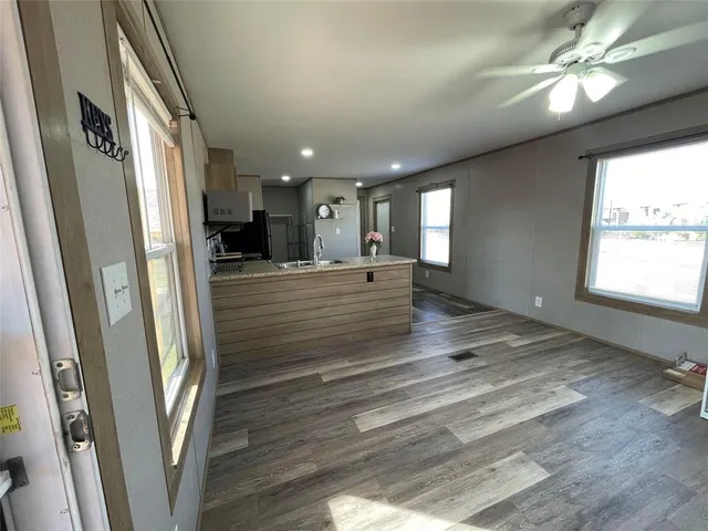 a kitchen with stainless steel appliances a refrigerator and a stove