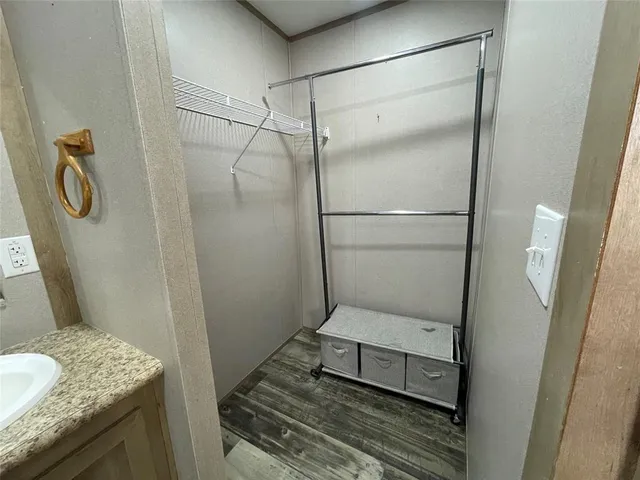 a bathroom with a sink and shower