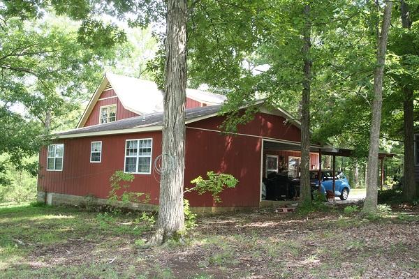 2030 Gentle Road Lewisburg, TN 37091 - Photo 2 of 20 Back view of home with covered carport. Garage is to the right. 2 back door entrances.