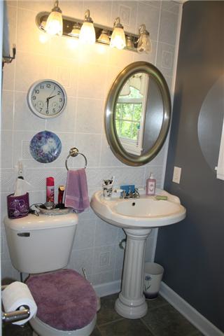 2030 Gentle Road Lewisburg, TN 37091 - Photo 12 of 20 Full bath in hall near den and bedrooms. Over sized walk-in shower on left with linen closet, and window.