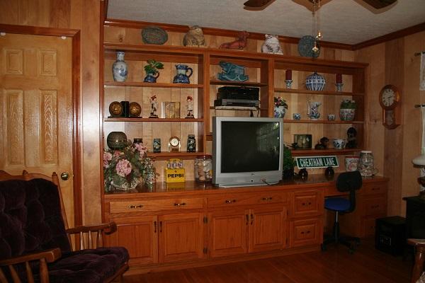 2030 Gentle Road Lewisburg, TN 37091 - Photo 10 of 20 Wonderful cozy 13x14 den with a whole wall of built-in bookcases and closet to left. Back door entrance on left and double windows on right.