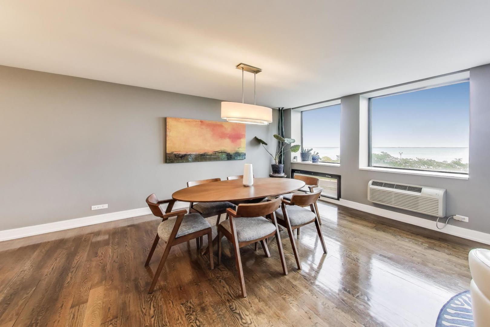 1110 North Lake Shore Drive, Unit 3N Chicago, IL 60611 - Photo 11 of 45 a view of a dining room with furniture and wooden floor