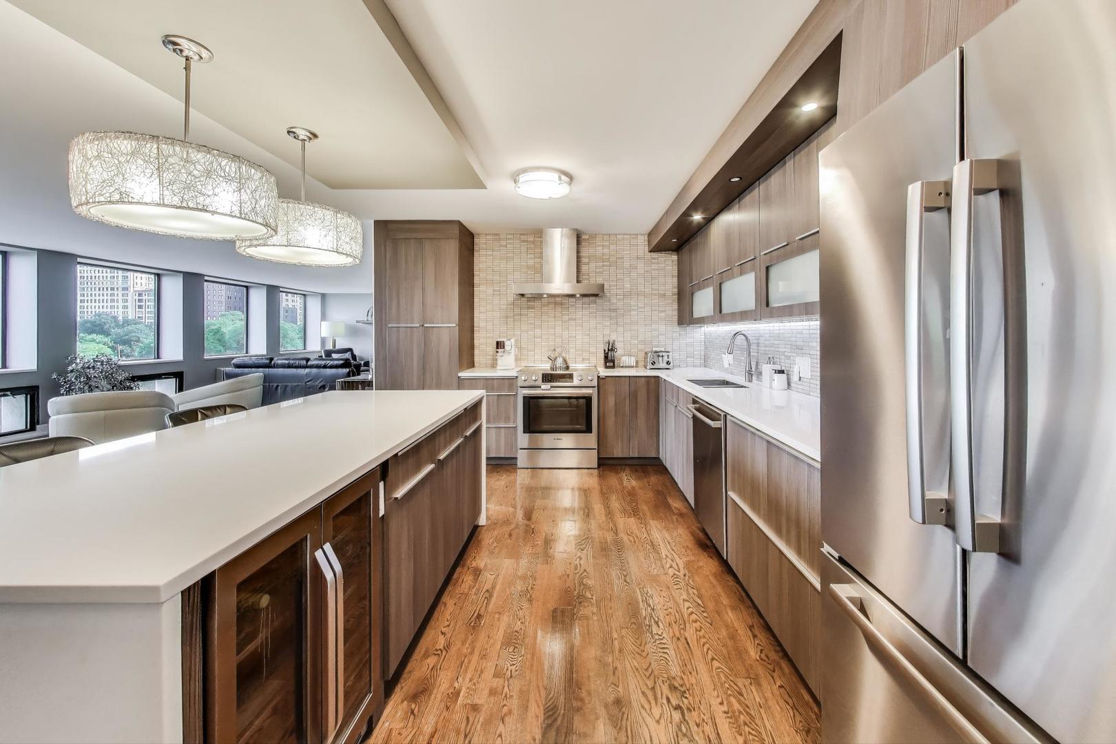 1110 North Lake Shore Drive, Unit 3N Chicago, IL 60611 - Photo 15 of 45 a kitchen with stainless steel appliances a sink stove and refrigerator