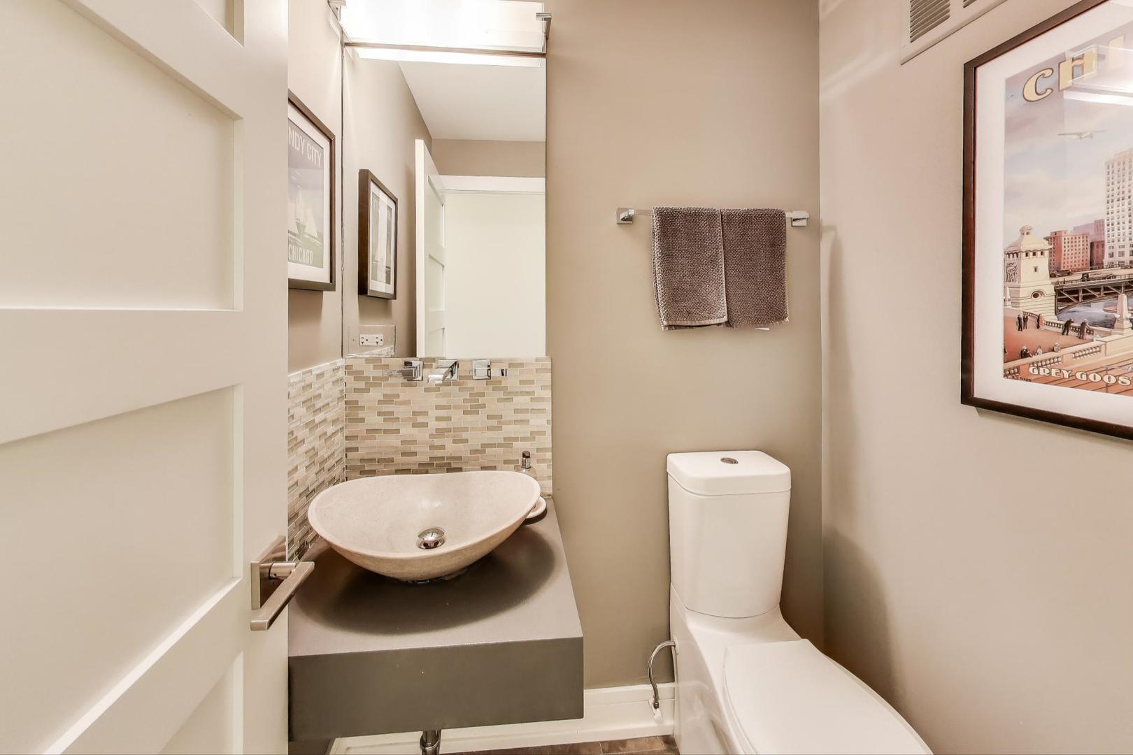 1110 North Lake Shore Drive, Unit 3N Chicago, IL 60611 - Photo 29 of 45 a bathroom with a toilet and a mirror