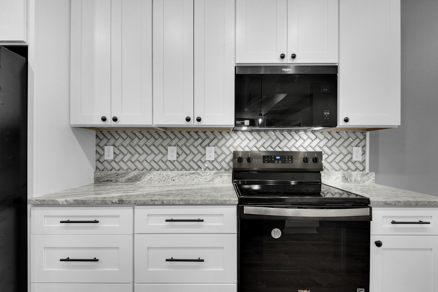 363 Washington Valparaiso, FL 32580 - Photo 14 of 35 a kitchen with stainless steel appliances granite countertop white cabinets and a stove top oven with granite countertops