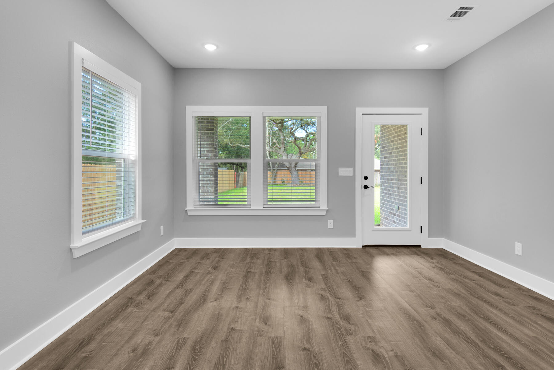 363 Washington Valparaiso, FL 32580 - Photo 18 of 35 a view of an empty room with wooden floor and a window