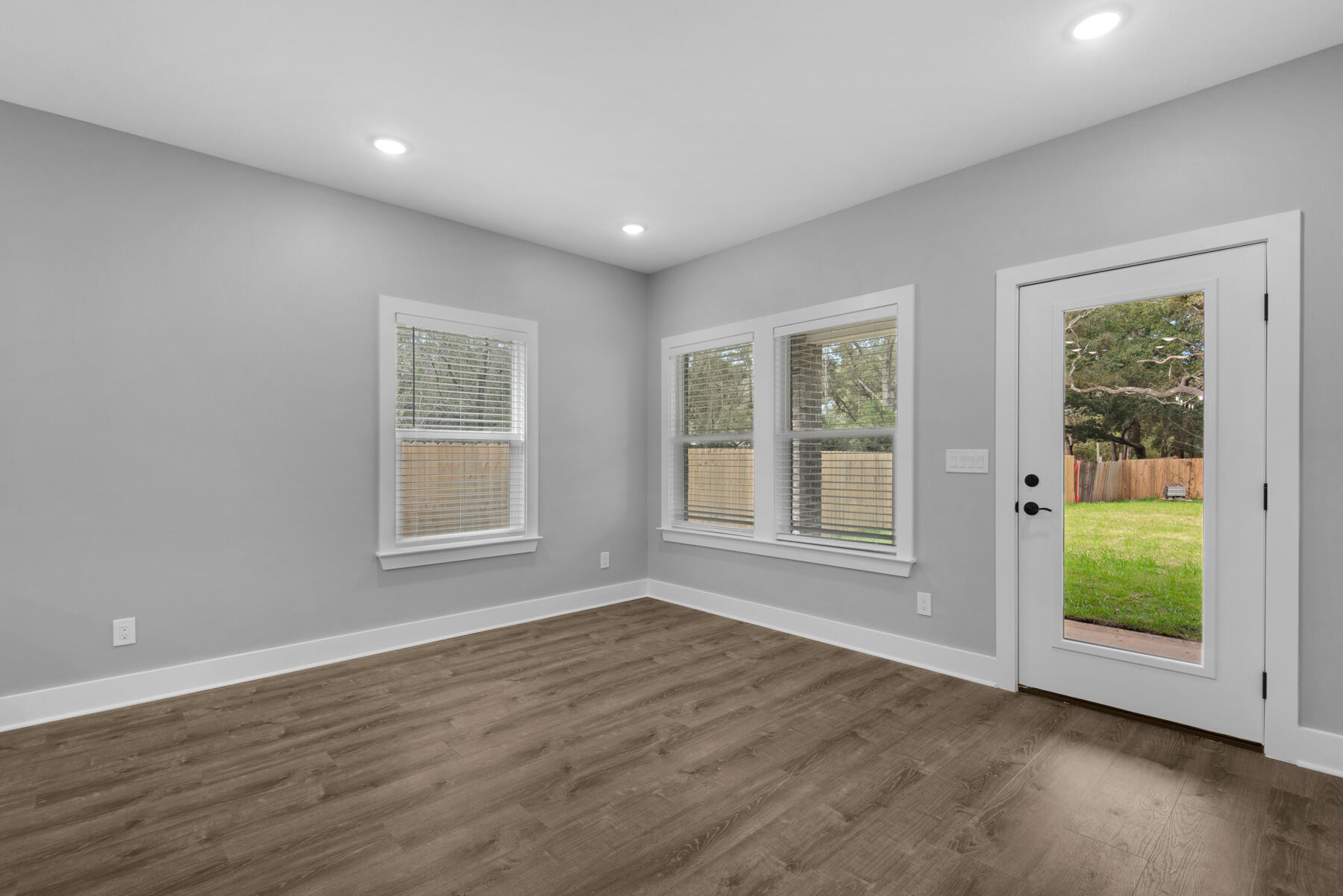 363 Washington Valparaiso, FL 32580 - Photo 19 of 35 a view of an empty room with wooden floor and a window