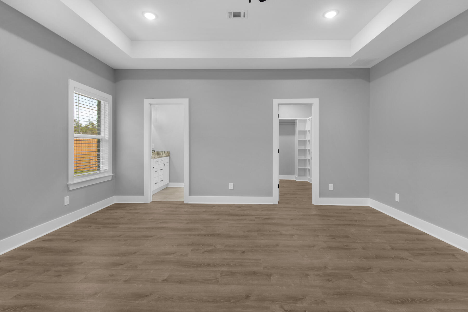 363 Washington Valparaiso, FL 32580 - Photo 22 of 35 a view of an empty room with window and wooden floor