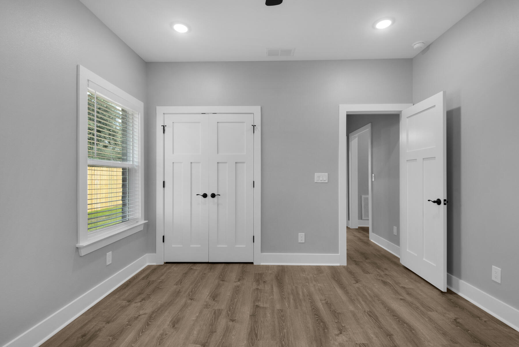 363 Washington Valparaiso, FL 32580 - Photo 31 of 35 a view of an empty room with wooden floor and a window