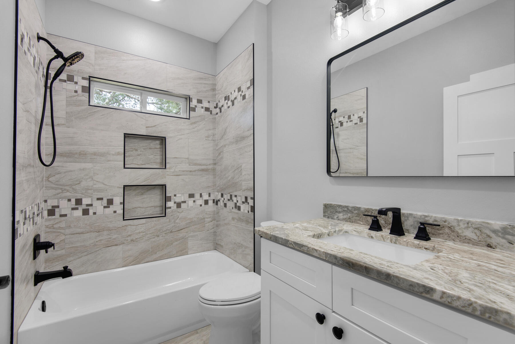 363 Washington Valparaiso, FL 32580 - Photo 32 of 35 a bathroom with a granite countertop sink a toilet and bathtub