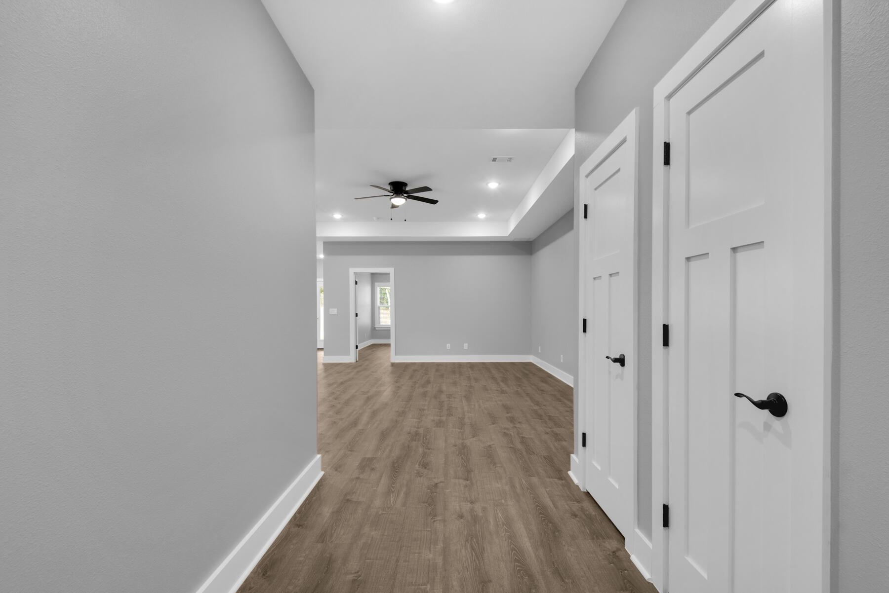 363 Washington Valparaiso, FL 32580 - Photo 7 of 35 a view of a hallway with wooden floor and a bathroom