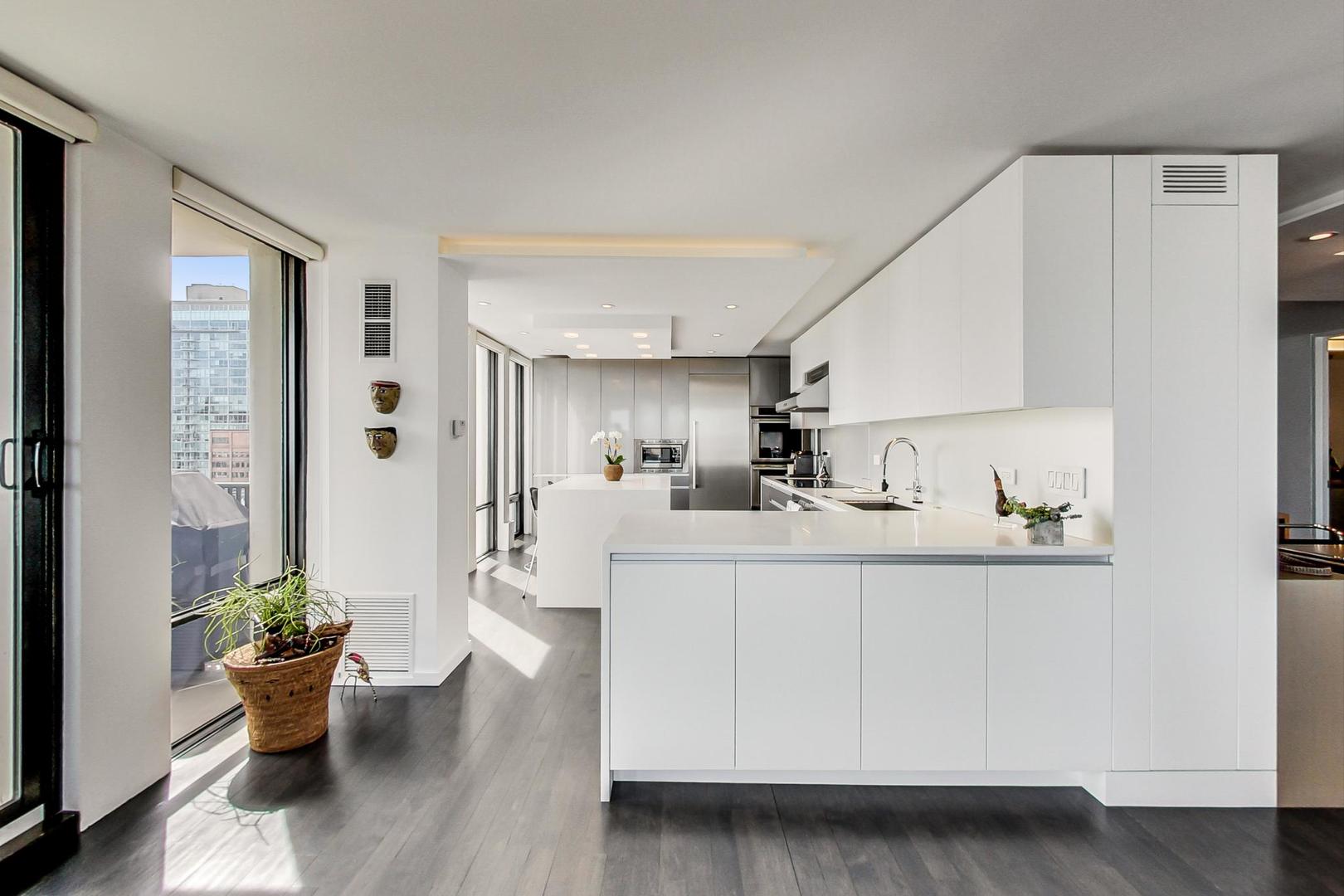 Undisclosed Address Chicago, IL 60611 - Photo 12 of 50 a view of kitchen with furniture and wooden floor