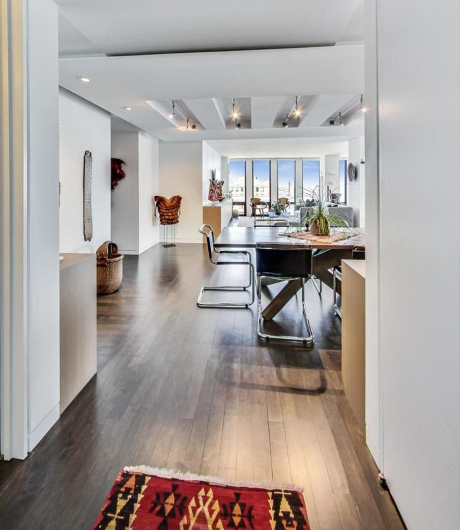 Undisclosed Address Chicago, IL 60611 - Photo 2 of 50 a living room with furniture and view of kitchen