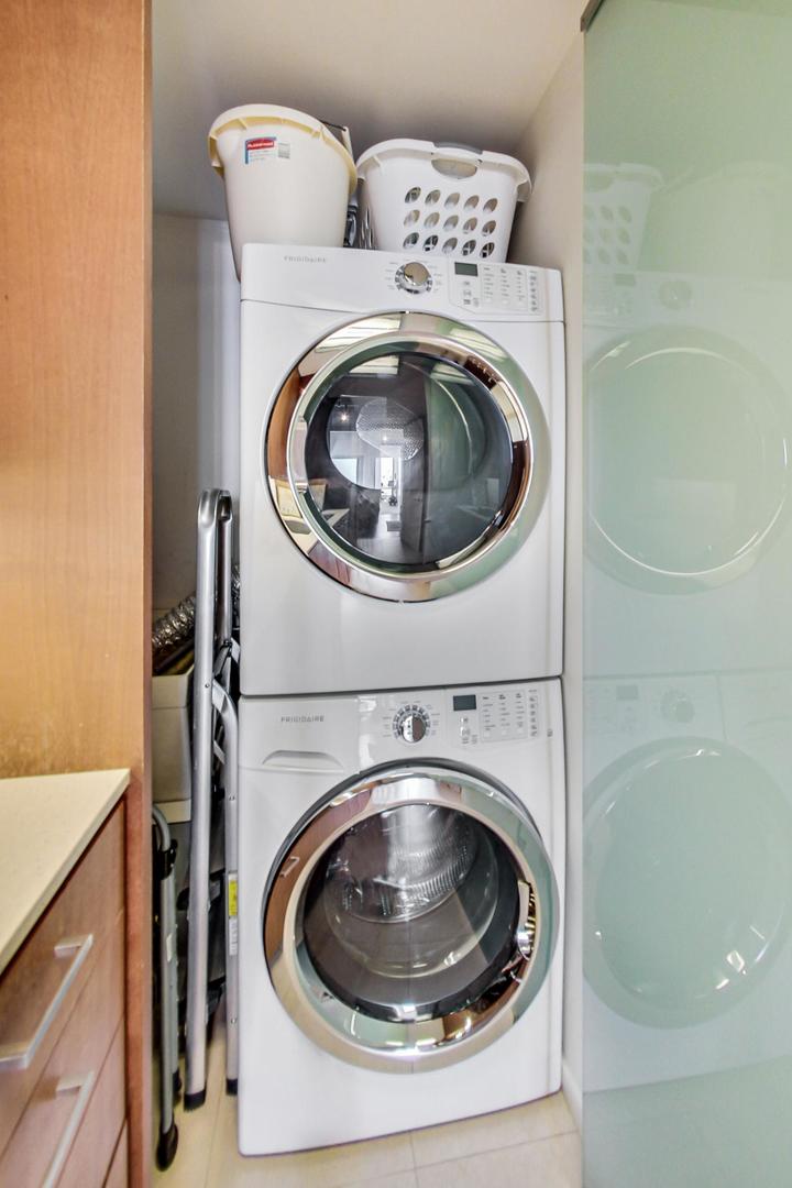 Undisclosed Address Chicago, IL 60611 - Photo 36 of 50 a utility room with dryer and washer