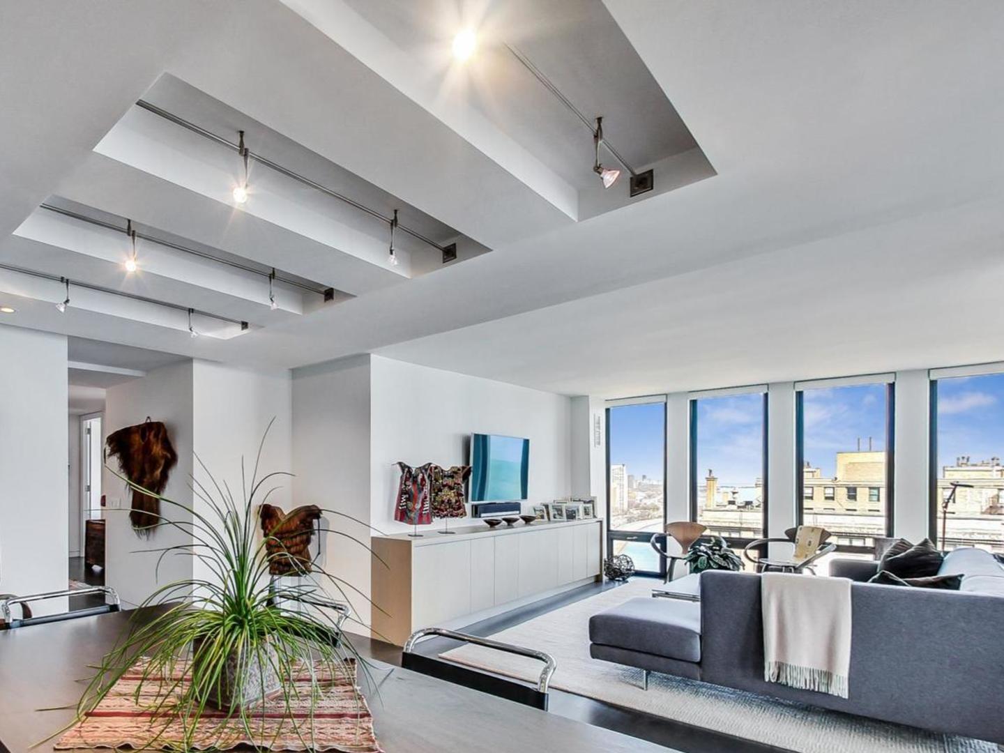 Undisclosed Address Chicago, IL 60611 - Photo 6 of 50 a living room with furniture and a large window