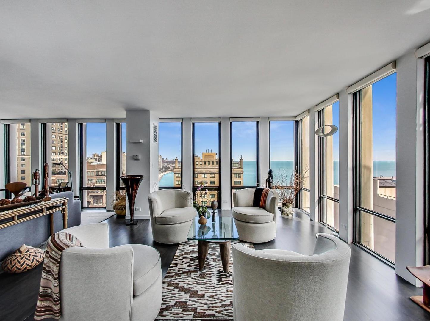 Undisclosed Address Chicago, IL 60611 - Photo 7 of 50 a living room with furniture and large windows