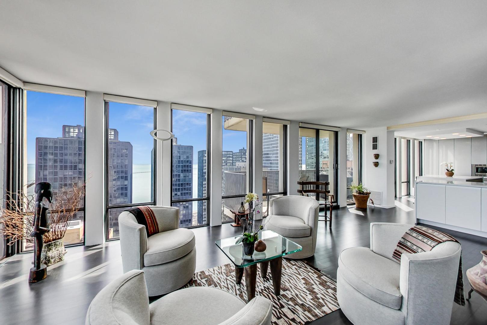 Undisclosed Address Chicago, IL 60611 - Photo 8 of 50 a living room with furniture and a large window