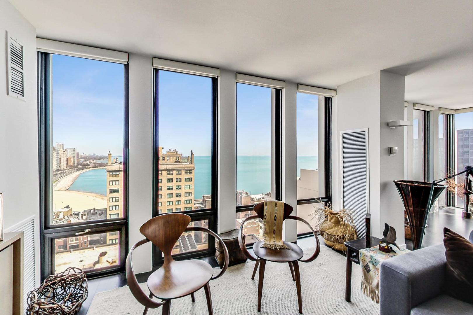 Undisclosed Address Chicago, IL 60611 - Photo 9 of 50 a view of a livingroom with furniture and floor to ceiling window
