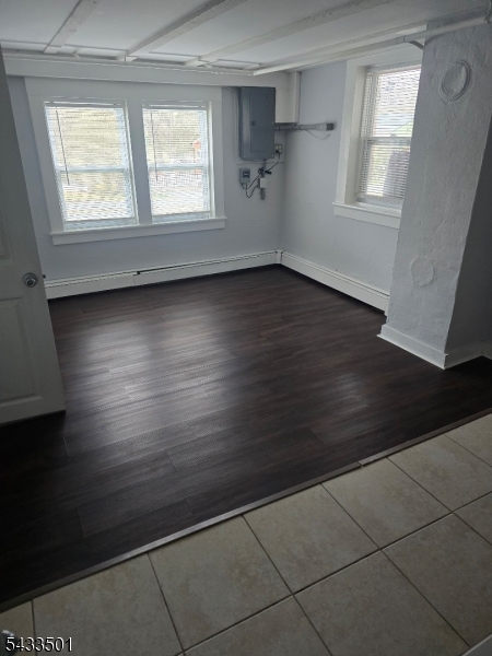 16 Musconetcong River Road, Unit 2 Hampton, NJ 08827 - Photo 9 of 12 an empty room with wooden floor and windows