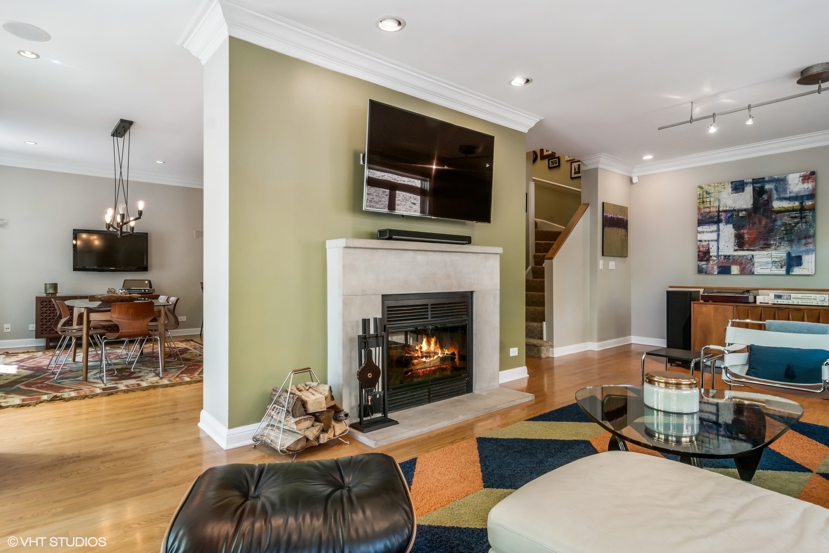 1606 North Mohawk Street, Unit B Chicago, IL 60614 - Photo 6 of 29 a living room with furniture a fireplace and a flat screen tv