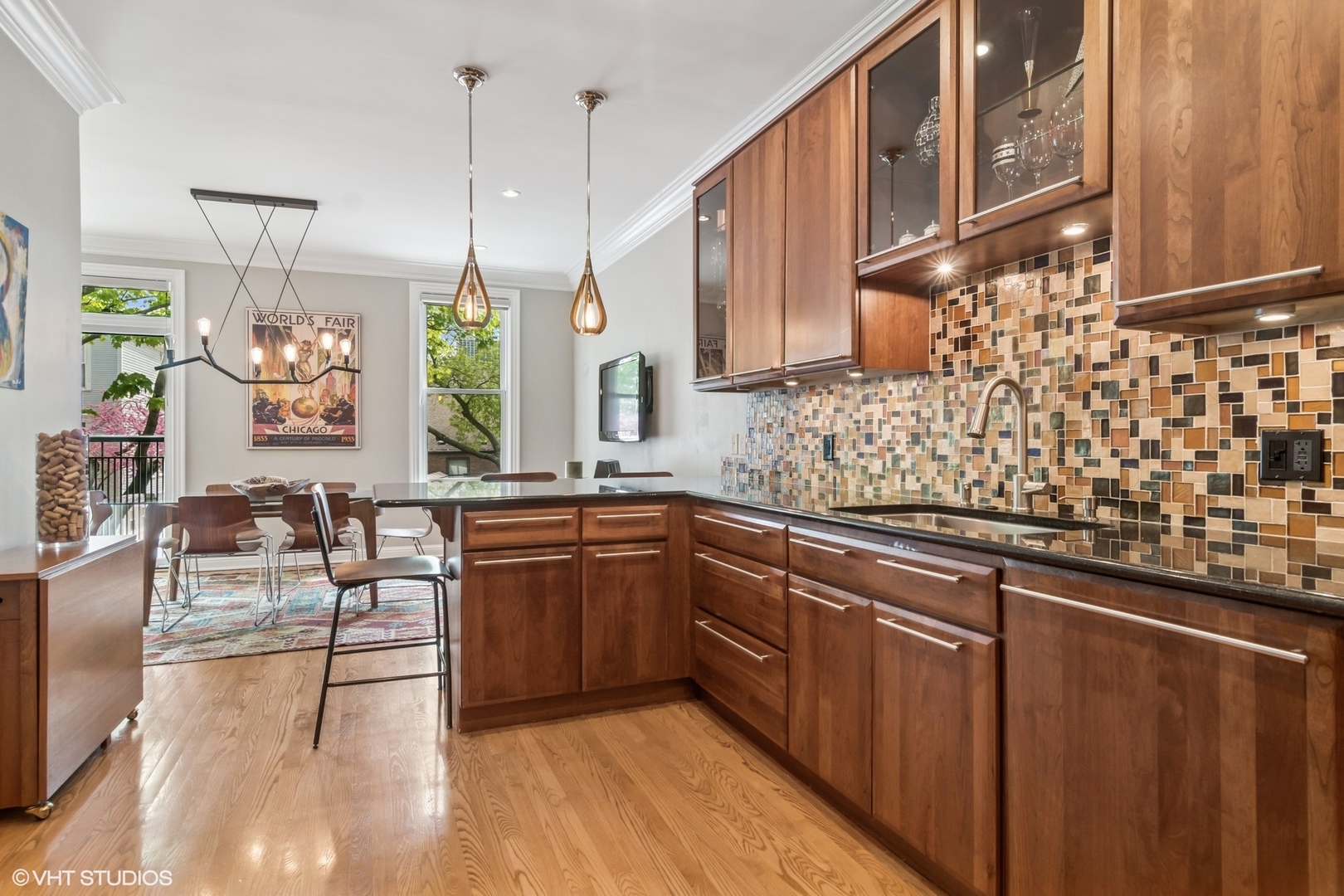 1606 North Mohawk Street, Unit B Chicago, IL 60614 - Photo 9 of 29 a kitchen with stainless steel appliances kitchen island granite countertop a sink and cabinets