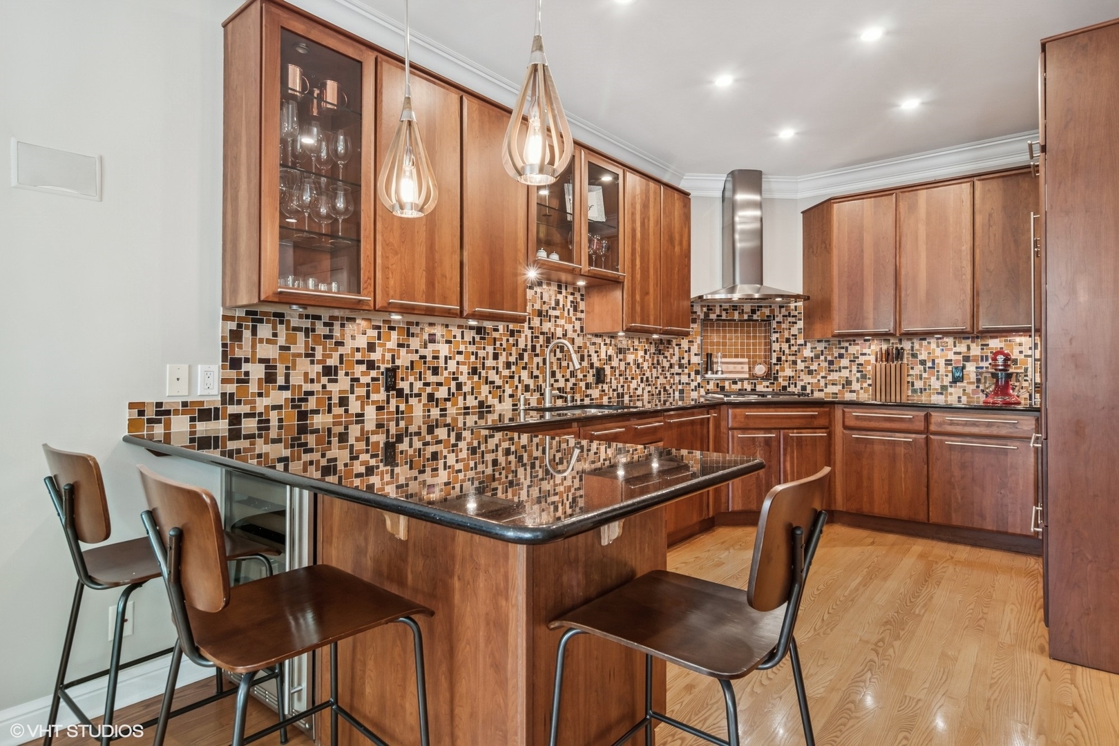 1606 North Mohawk Street, Unit B Chicago, IL 60614 - Photo 10 of 29 a kitchen with a table chairs sink and cabinets