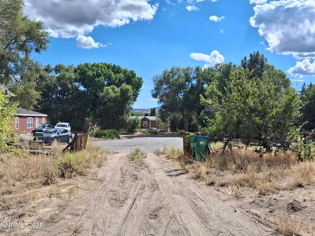 a view of a yard with swimming pool