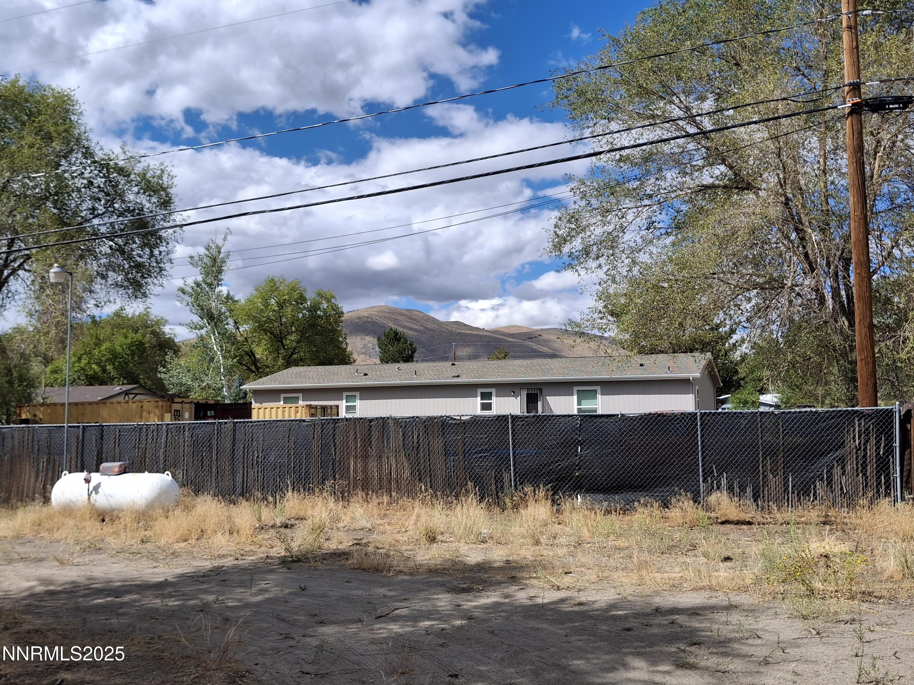 17845 Owl Court Reno, NV 89508 - Photo 9 of 14 a view of a yard with wooden fence