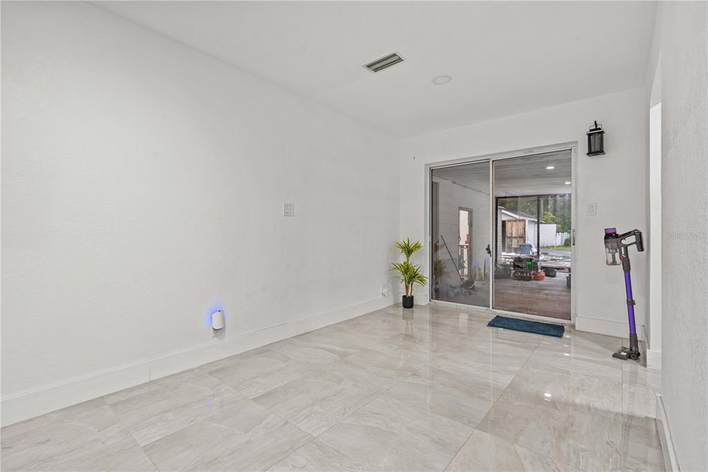 13002 East Wheeler Road Dover, FL 33527 - Photo 11 of 22 wooden floor and table in a room
