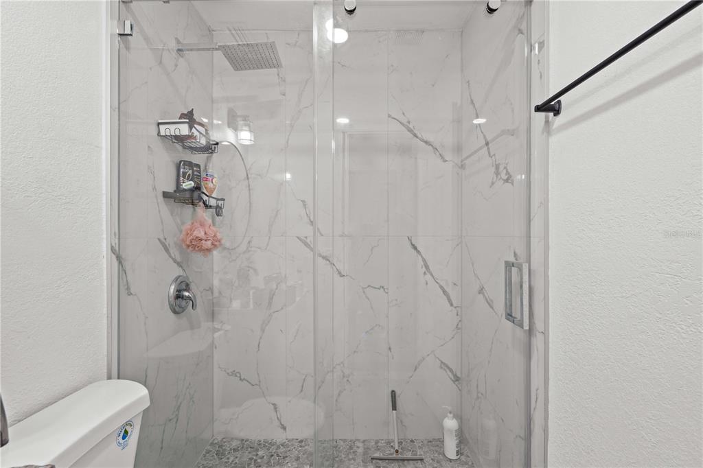 13002 East Wheeler Road Dover, FL 33527 - Photo 15 of 22 a bathroom with a shower