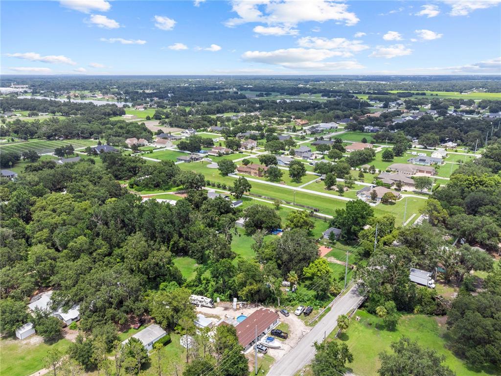 13002 East Wheeler Road Dover, FL 33527 - Photo 19 of 22 an aerial view of residential houses with city view