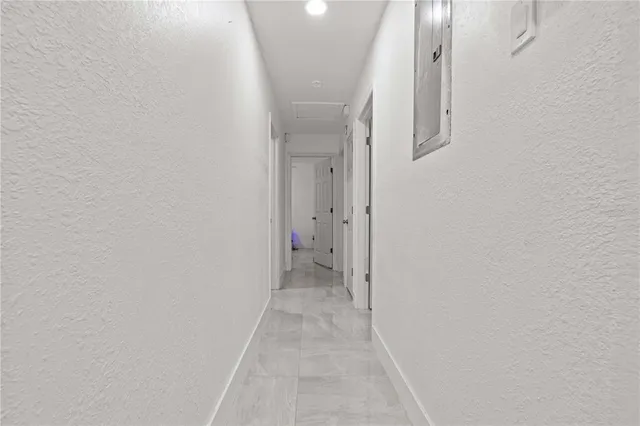 a kitchen with granite countertop a sink stove and cabinets
