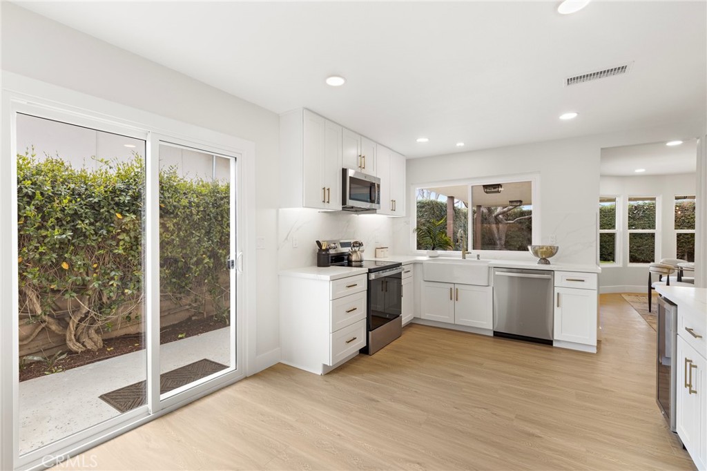7848 Calmcrest Drive Downey, CA 90240 - Photo 12 of 36 Open and spacious kitchen