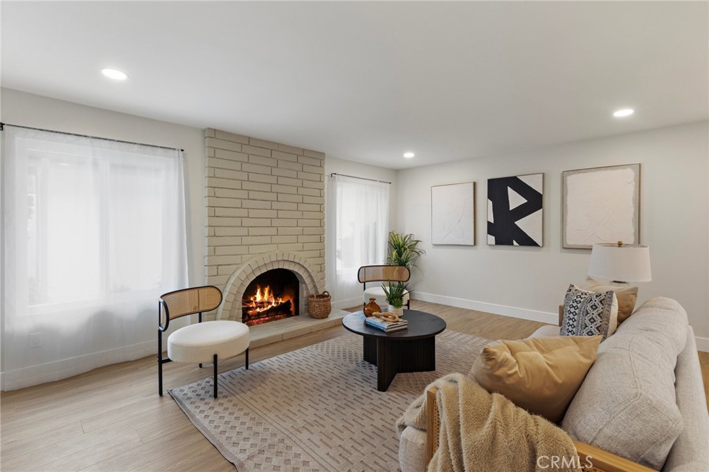 7848 Calmcrest Drive Downey, CA 90240 - Photo 17 of 36 Living room with cozy fireplace