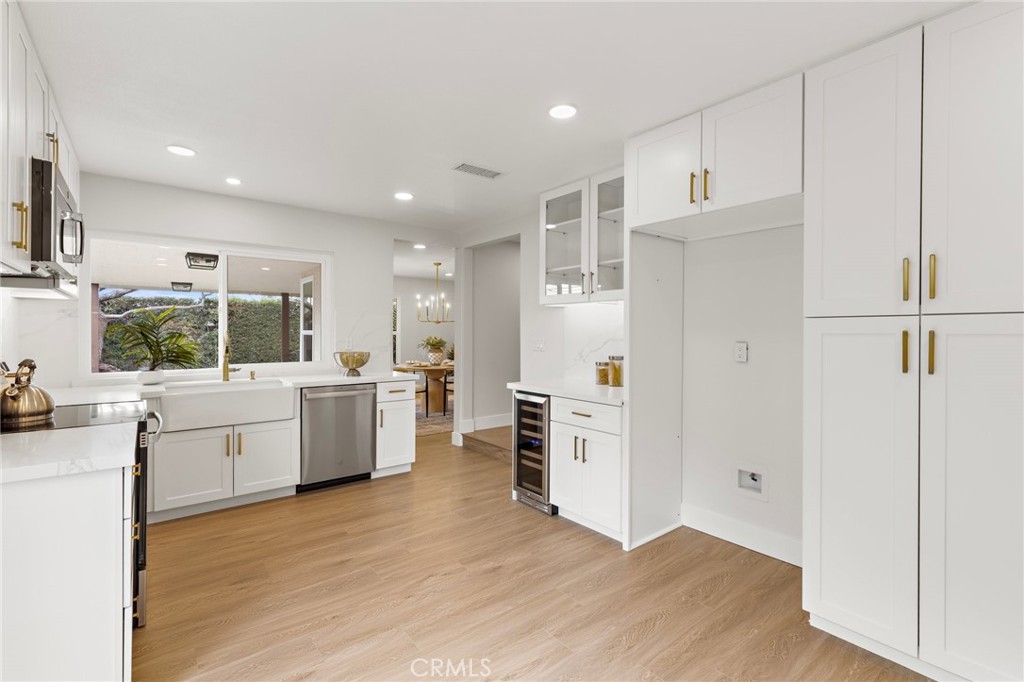 7848 Calmcrest Drive Downey, CA 90240 - Photo 9 of 36 Spacious upgraded kitchen with self-closing cabinets and drawers