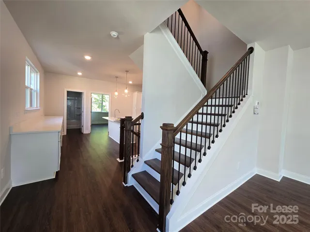 a view of entryway with wooden floor