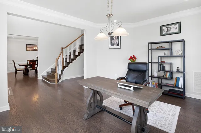 a view of a livingroom with furniture and chandelier