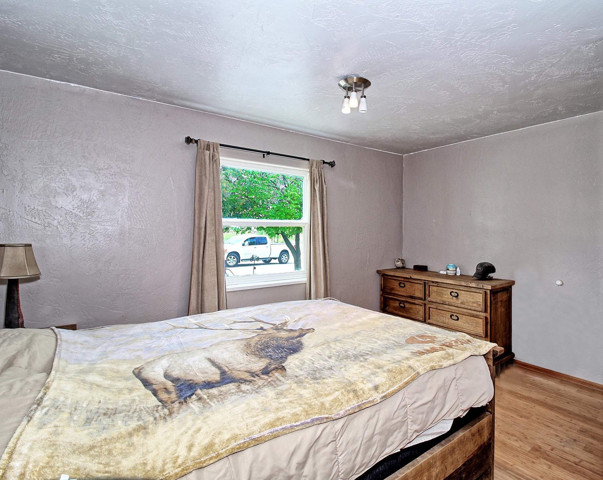 990 T Road Mack, CO 81525 - Photo 11 of 42 a bedroom with a bed and a window
