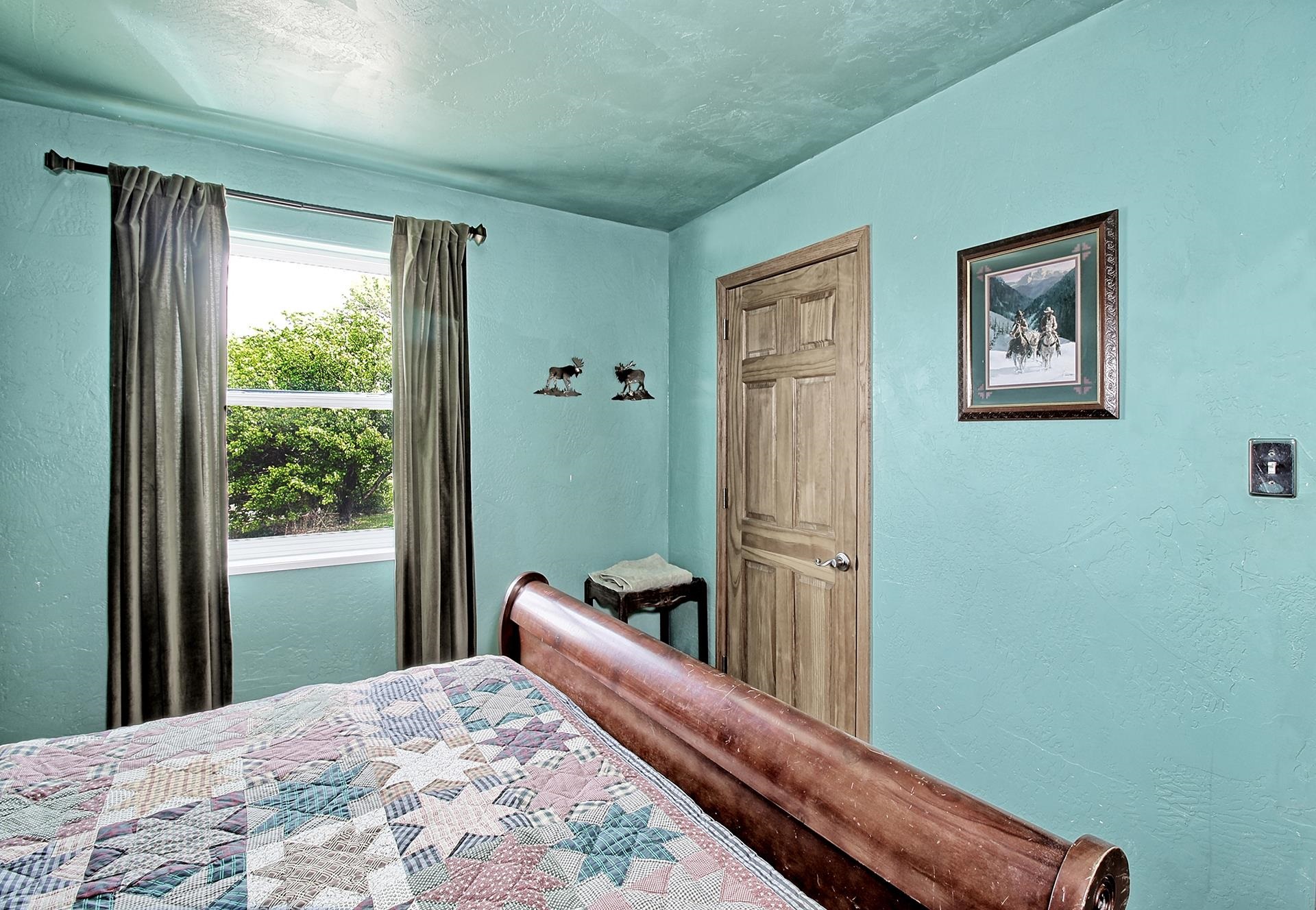 990 T Road Mack, CO 81525 - Photo 15 of 42 a bed room with a bed and a window