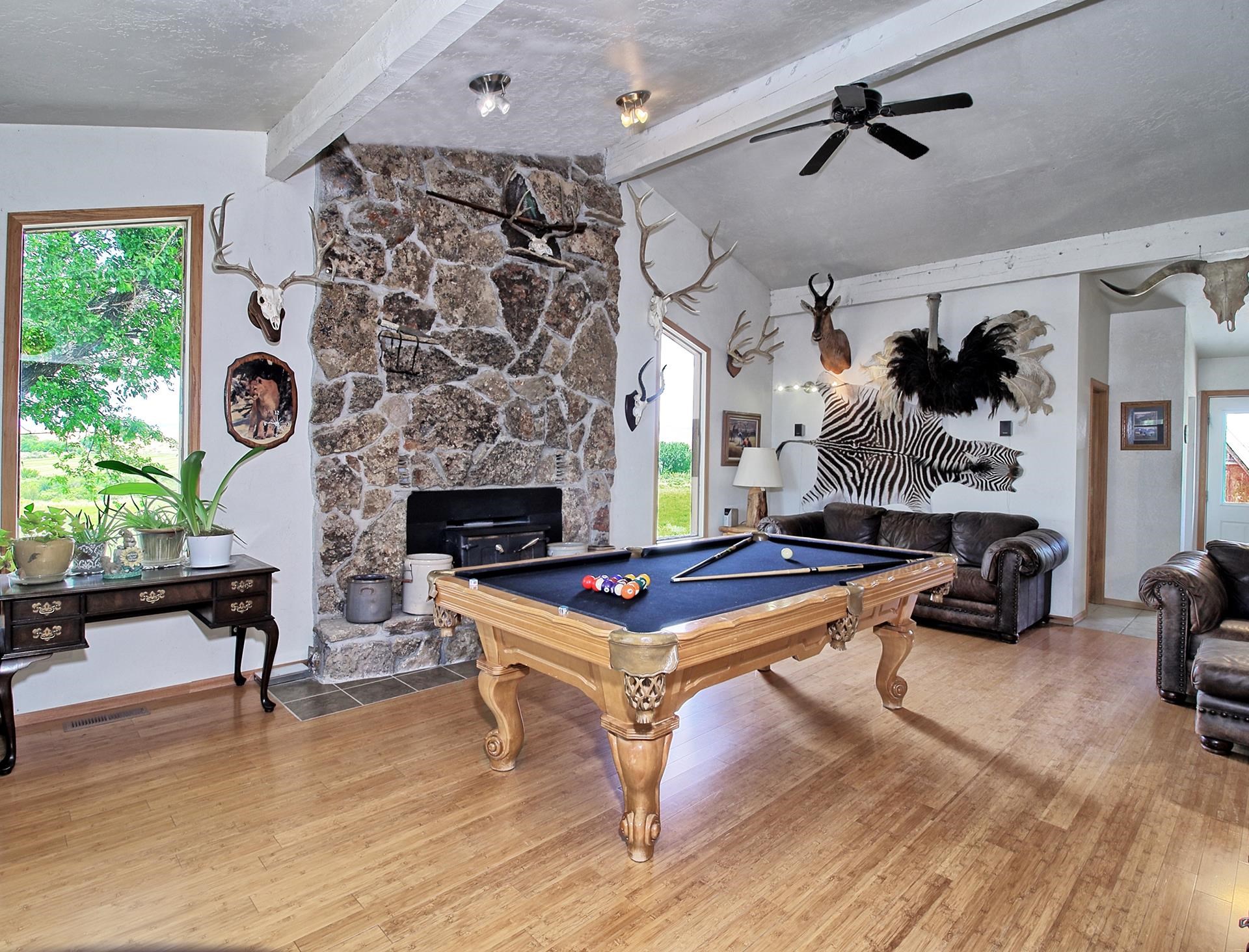 990 T Road Mack, CO 81525 - Photo 19 of 42 a living room with furniture and a fireplace
