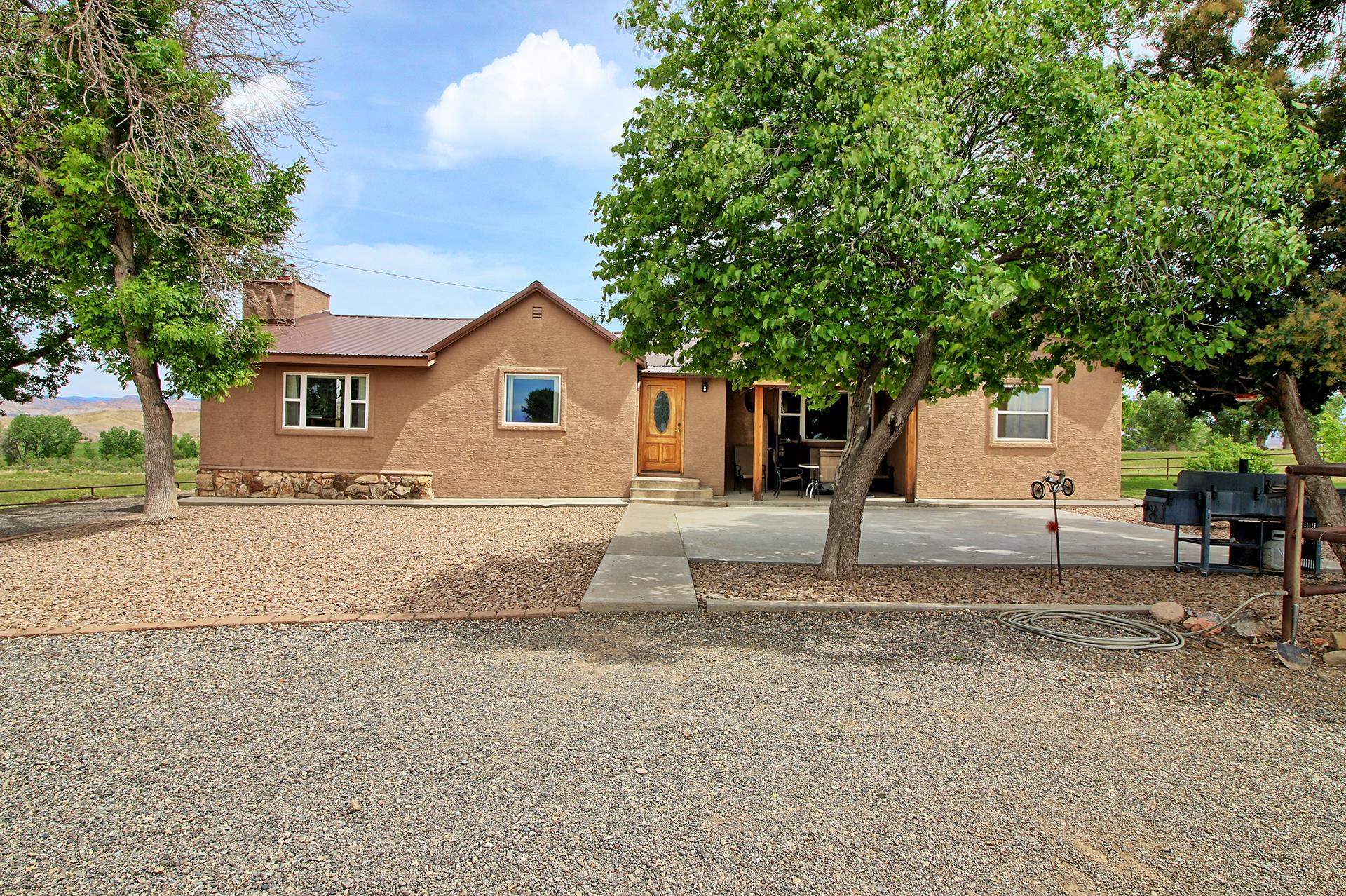 990 T Road Mack, CO 81525 - Photo 2 of 42 a house view with a outdoor space