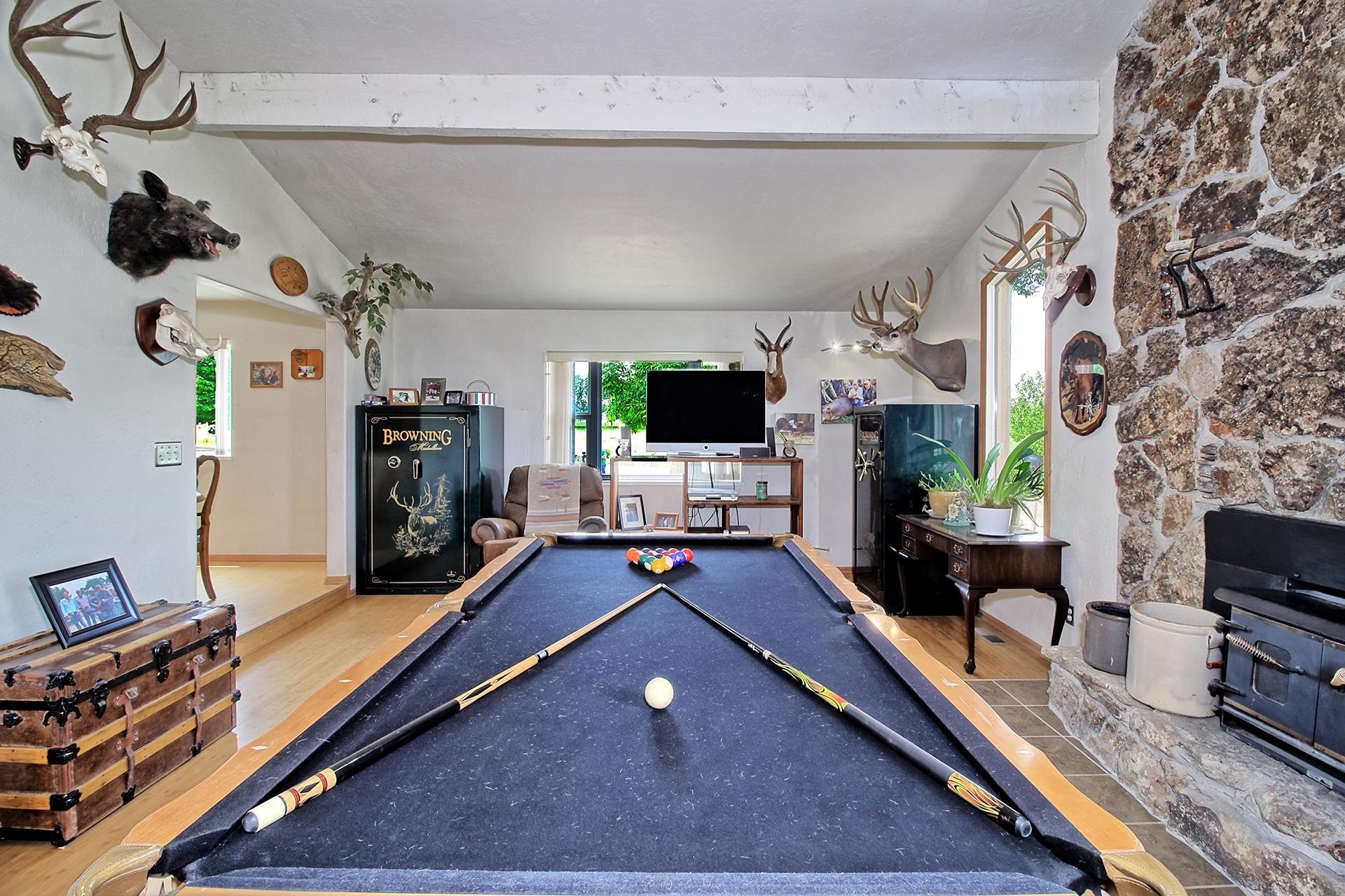 990 T Road Mack, CO 81525 - Photo 21 of 42 a living room with furniture gym equipment and a flat screen tv