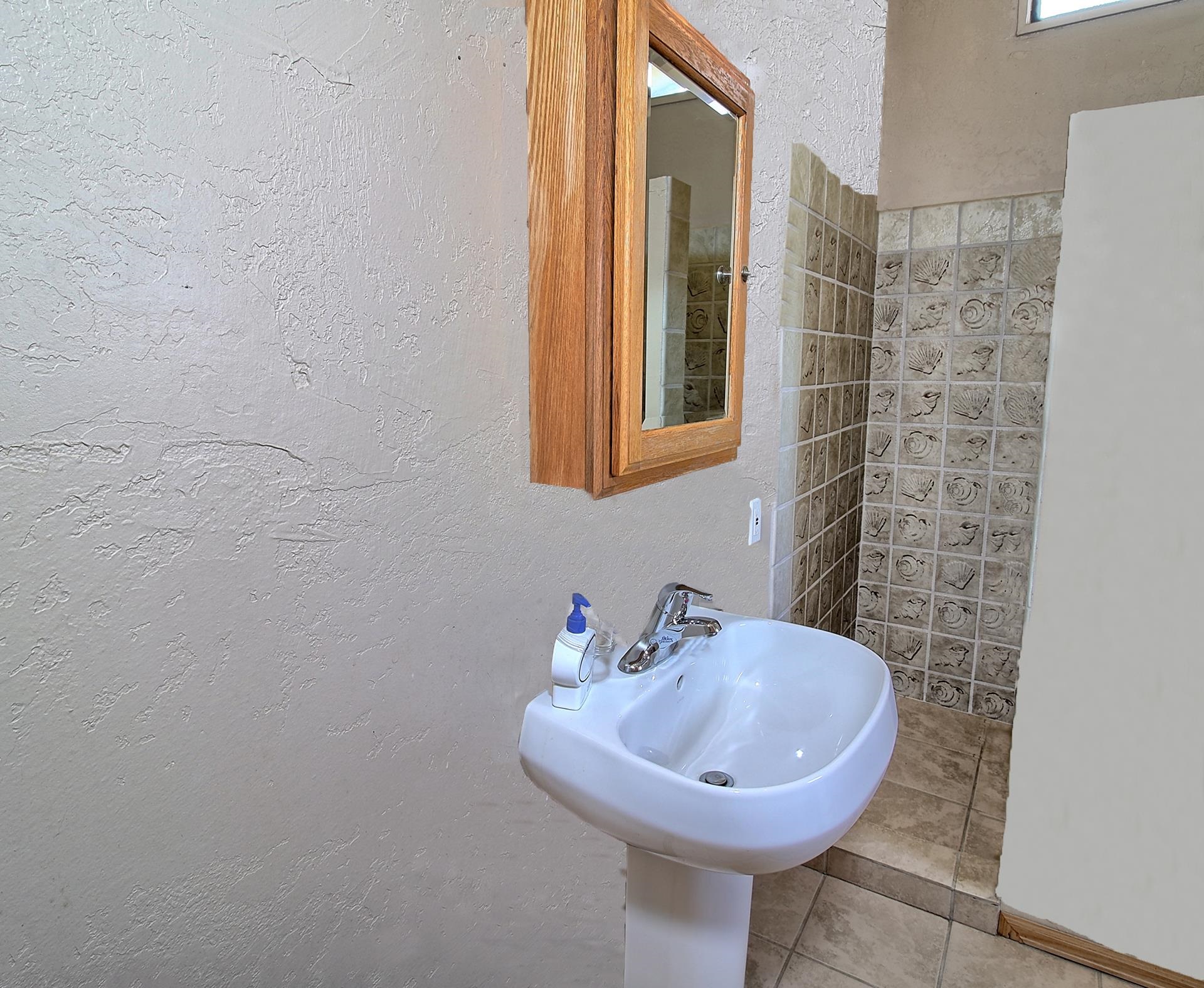 990 T Road Mack, CO 81525 - Photo 23 of 42 a bathroom with a sink a mirror and a toilet